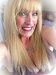 Real older whore is revealing her breasts